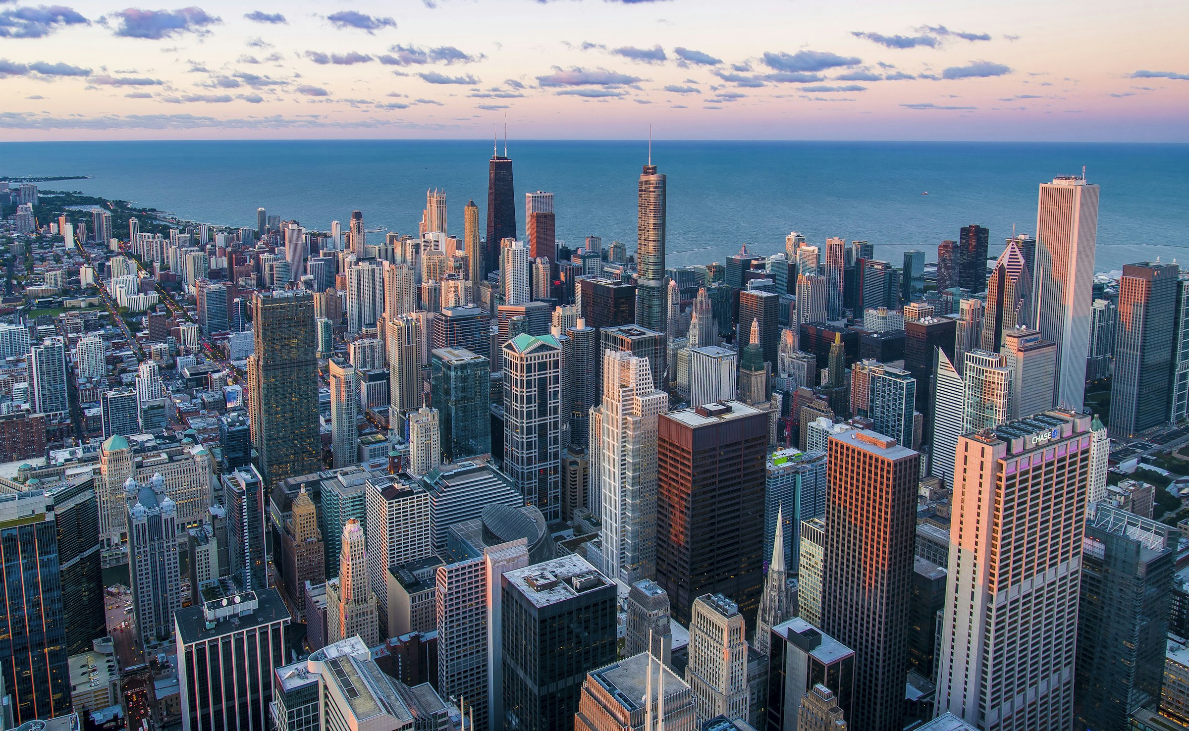 Aerial view of a North American city skyline at dusk